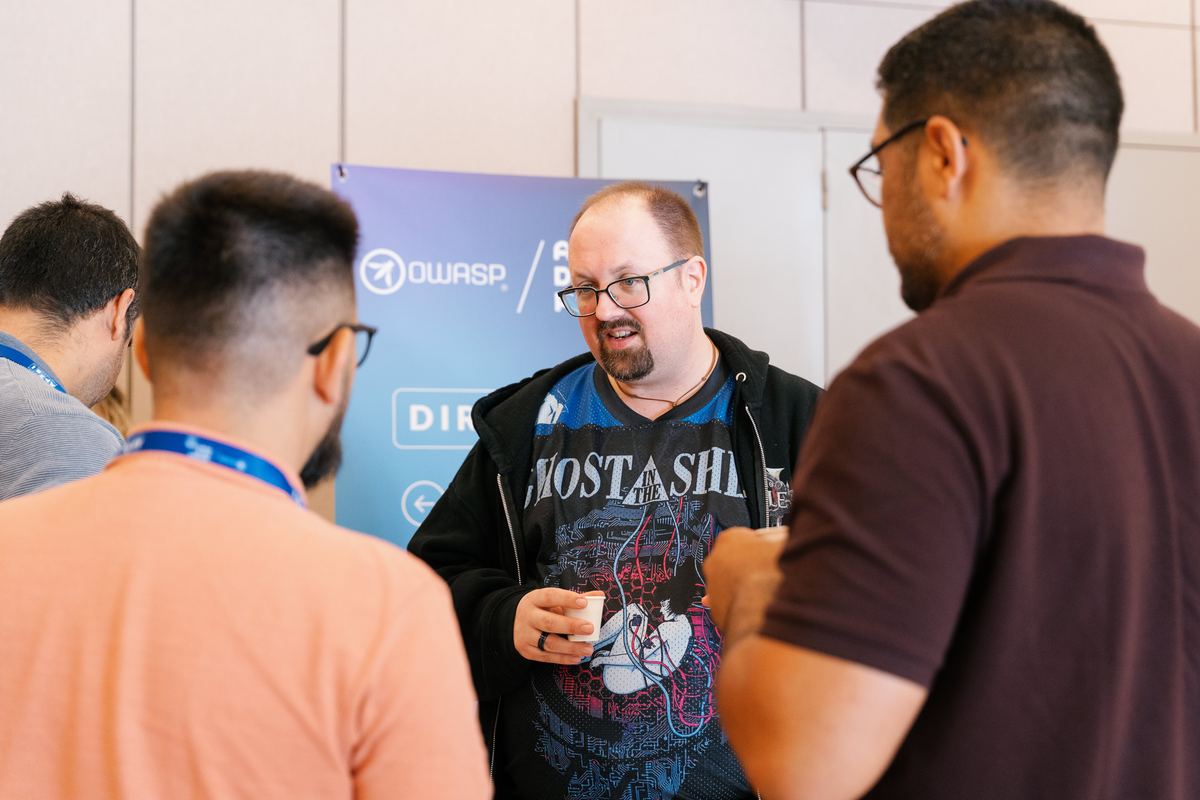 A trainer talking with attendees on the workshop day