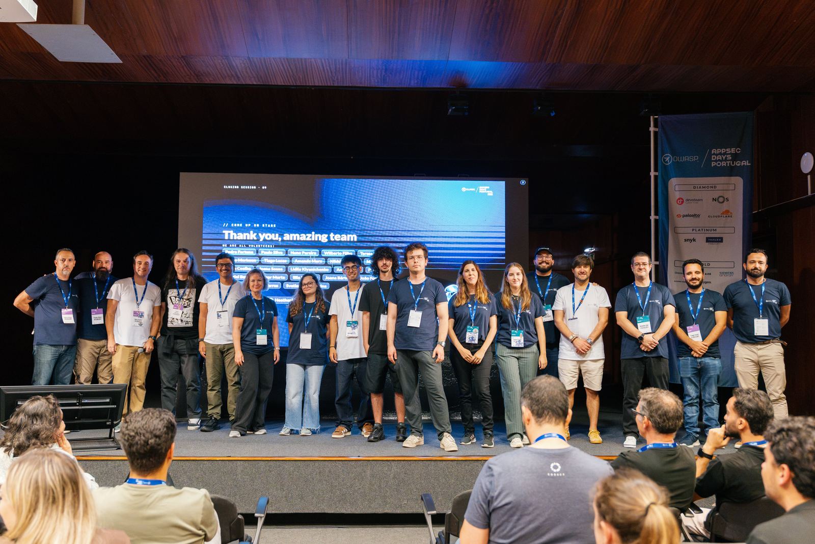 The AppSec Days Portugal volunteer team on stage at the closing session